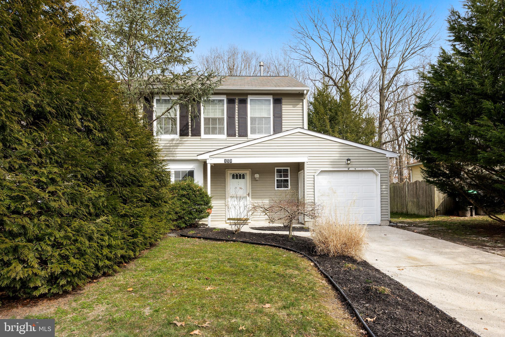 a front view of a house with yard