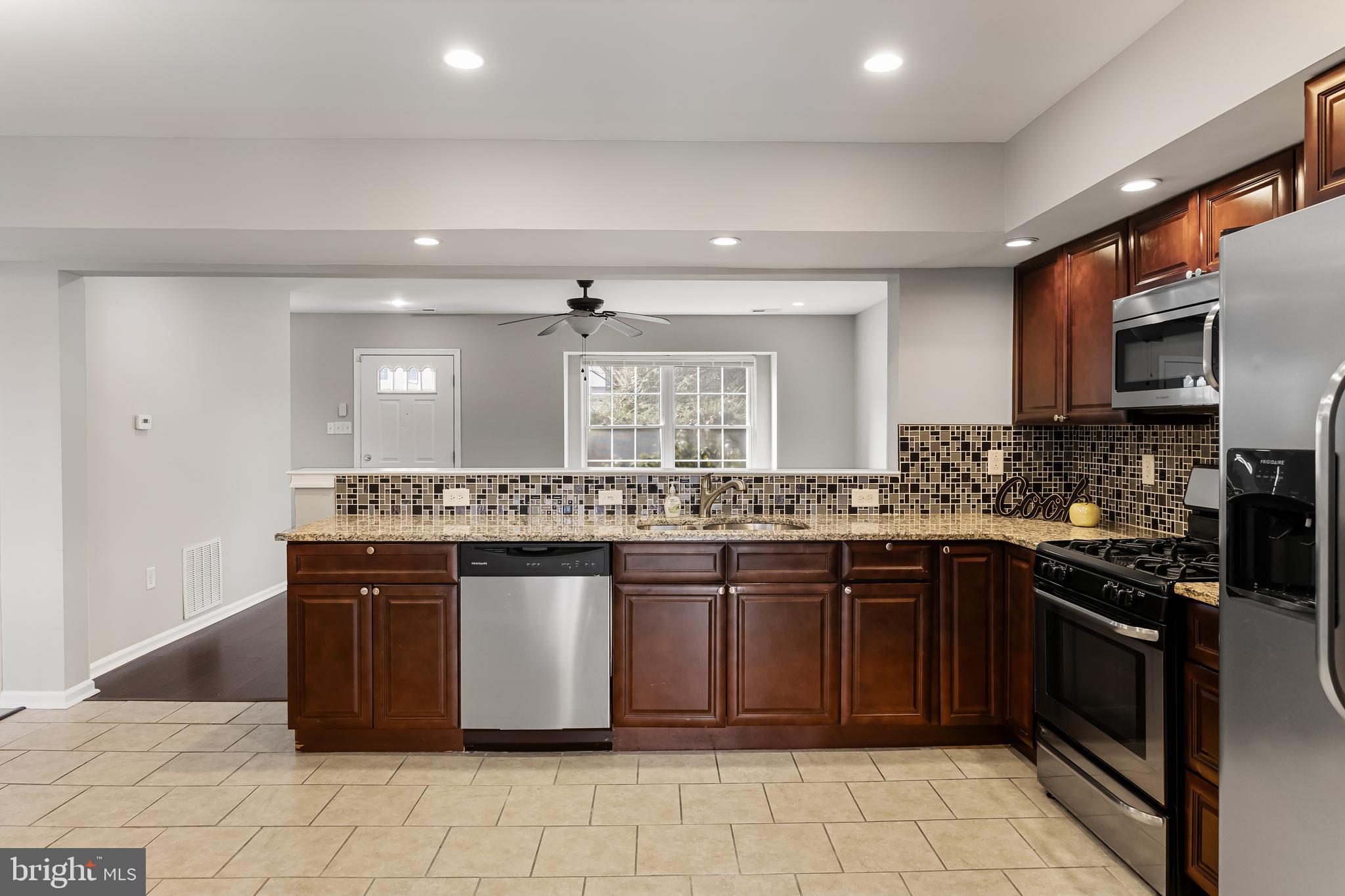 150 Baker Avenue Atco, NJ 08004 - Photo 11 of 32 a kitchen with a sink stove and cabinets