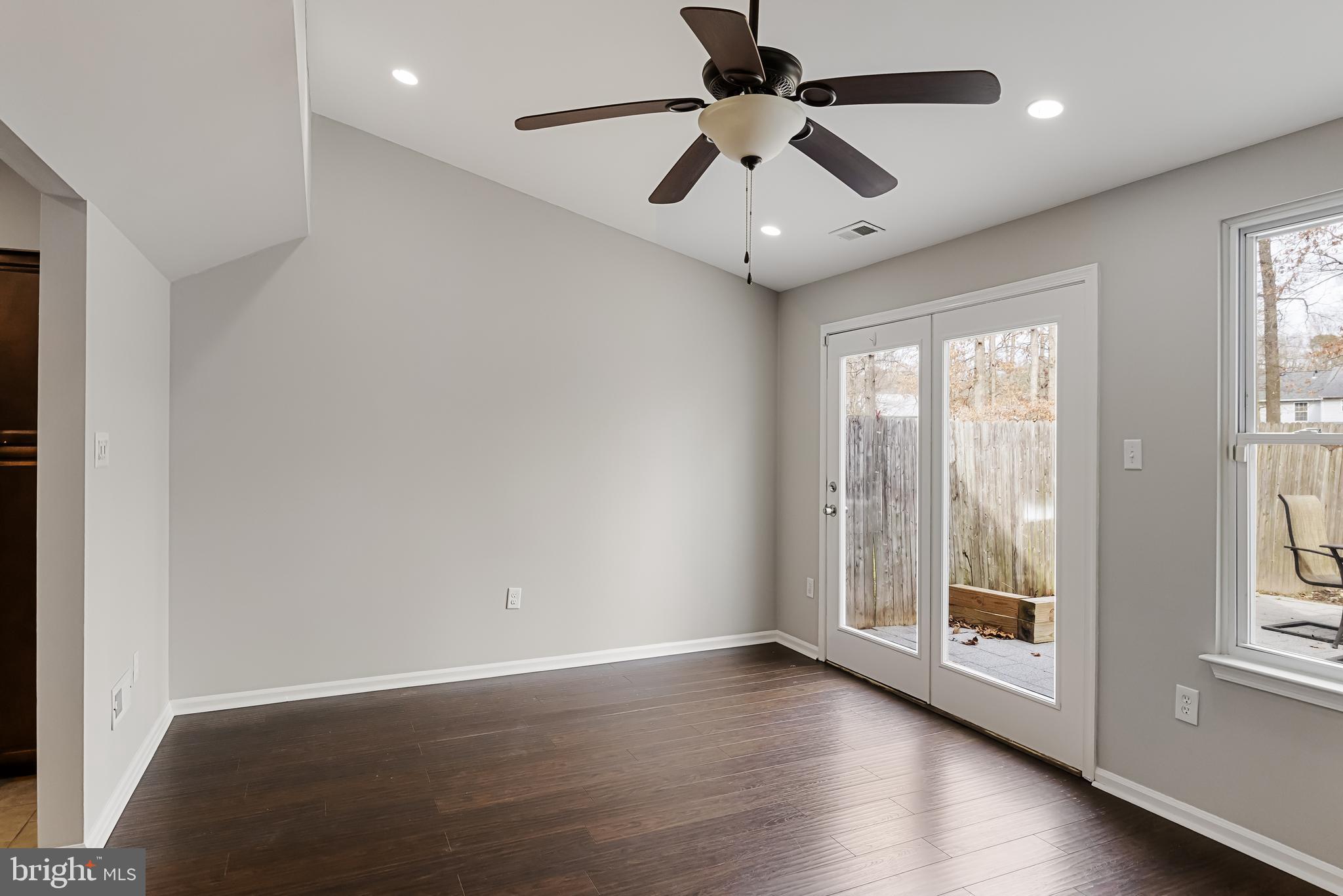 150 Baker Avenue Atco, NJ 08004 - Photo 16 of 32 an empty room with wooden floor and windows