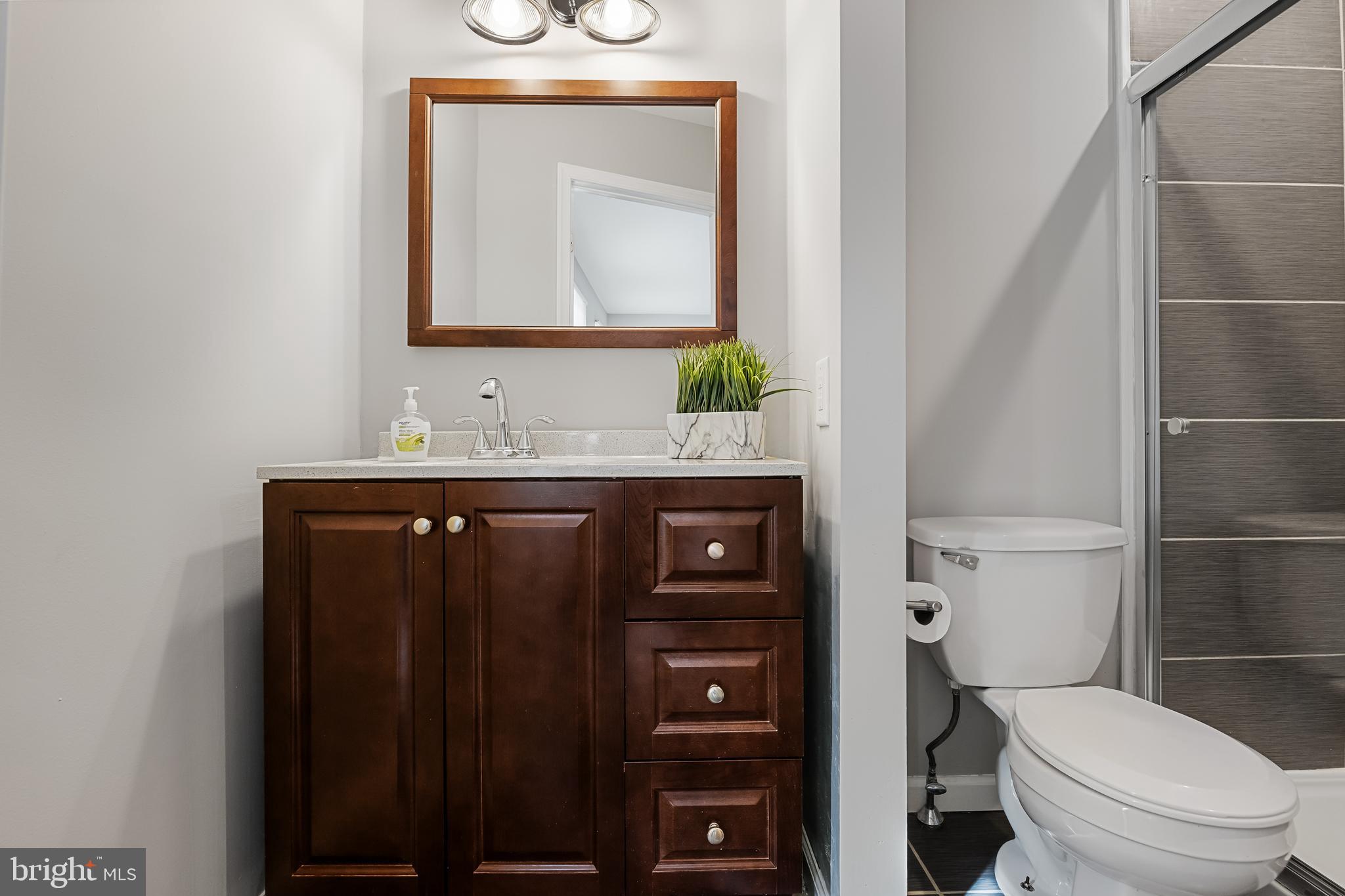 150 Baker Avenue Atco, NJ 08004 - Photo 22 of 32 a bathroom with a toilet sink and mirror