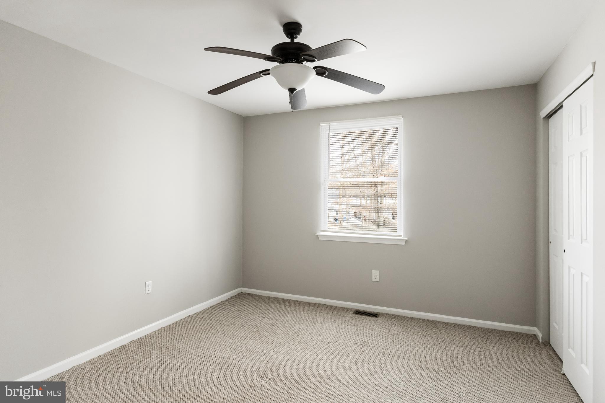150 Baker Avenue Atco, NJ 08004 - Photo 25 of 32 an empty room with a window and a fan