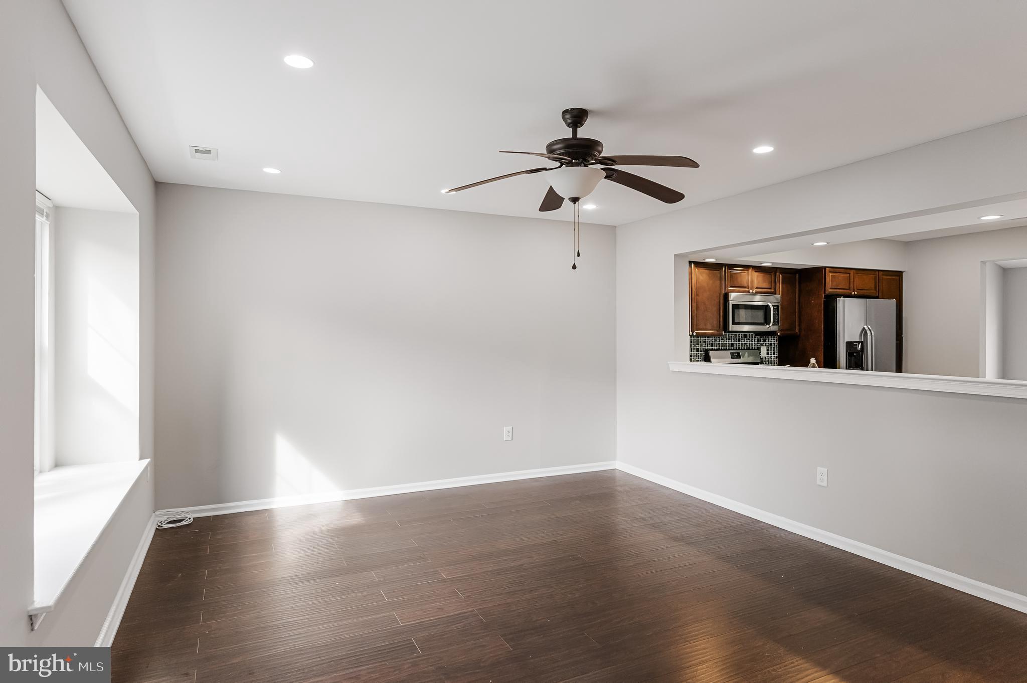 150 Baker Avenue Atco, NJ 08004 - Photo 4 of 32 a view of an empty room with wooden floor and a window