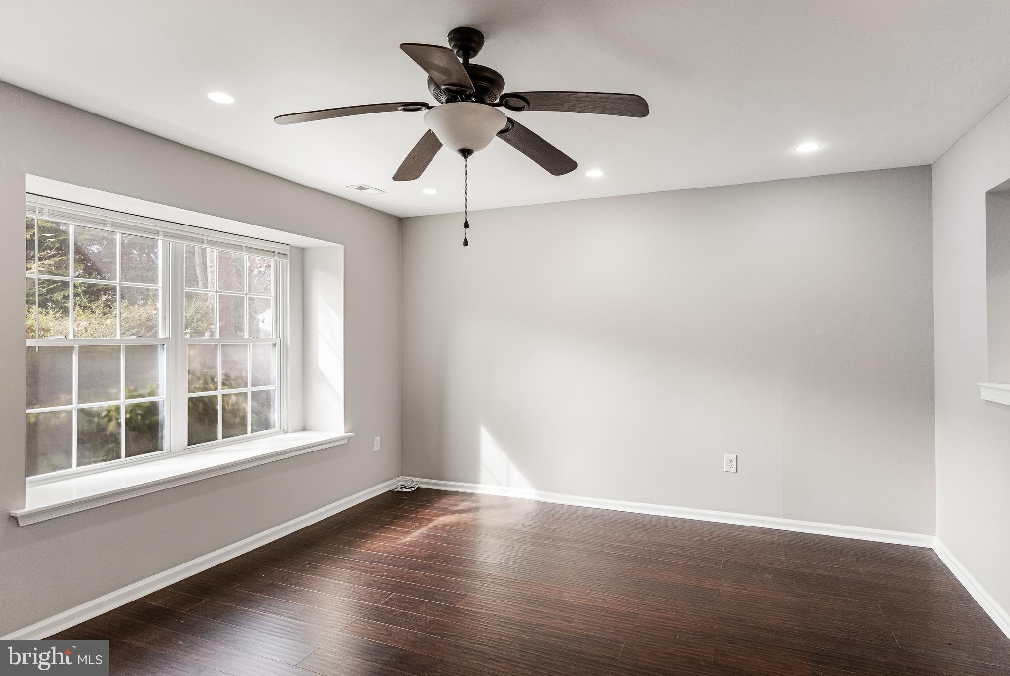 150 Baker Avenue Atco, NJ 08004 - Photo 5 of 32 a view of an empty room with wooden floor and a window