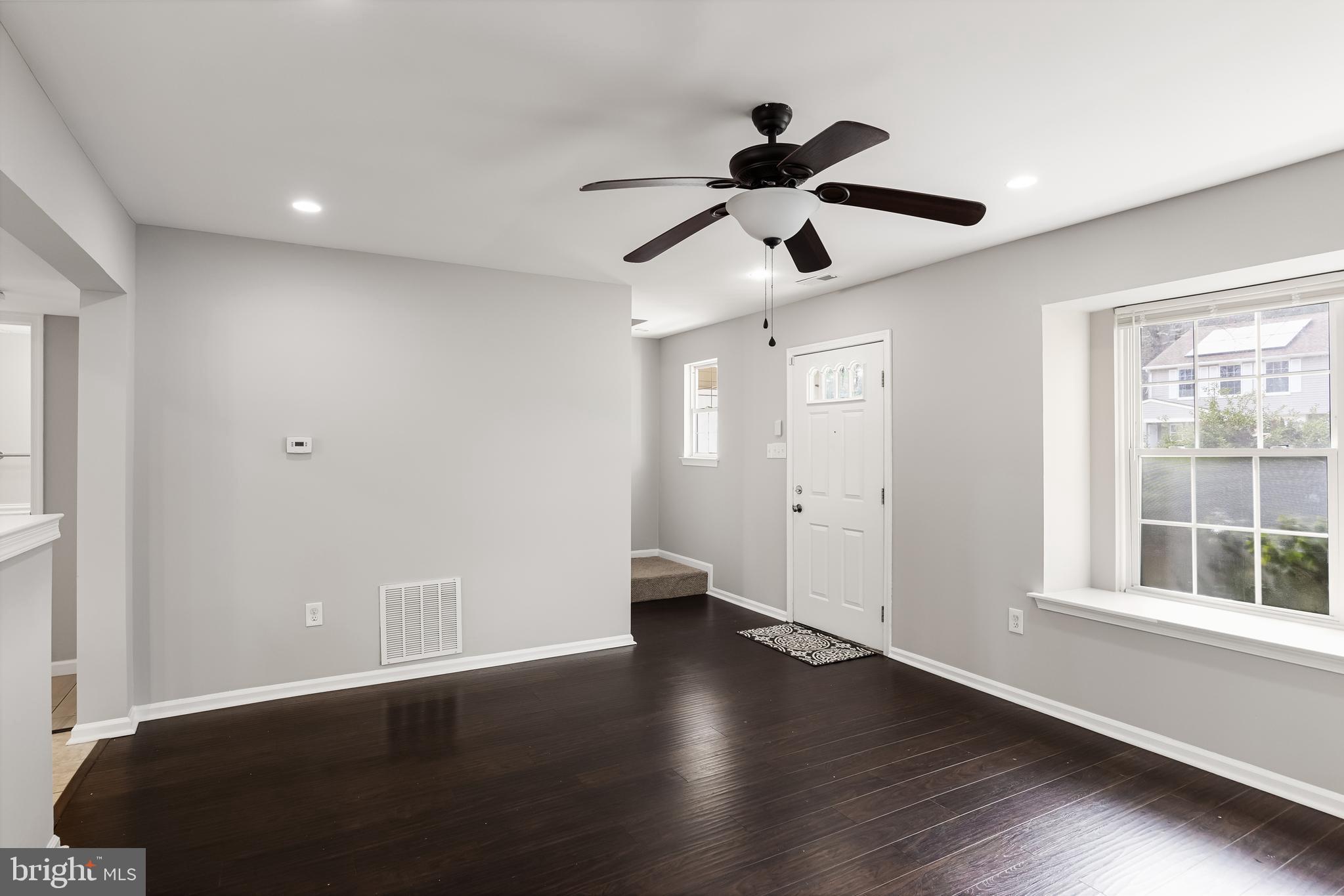 150 Baker Avenue Atco, NJ 08004 - Photo 6 of 32 a view of an empty room with wooden floor and a window