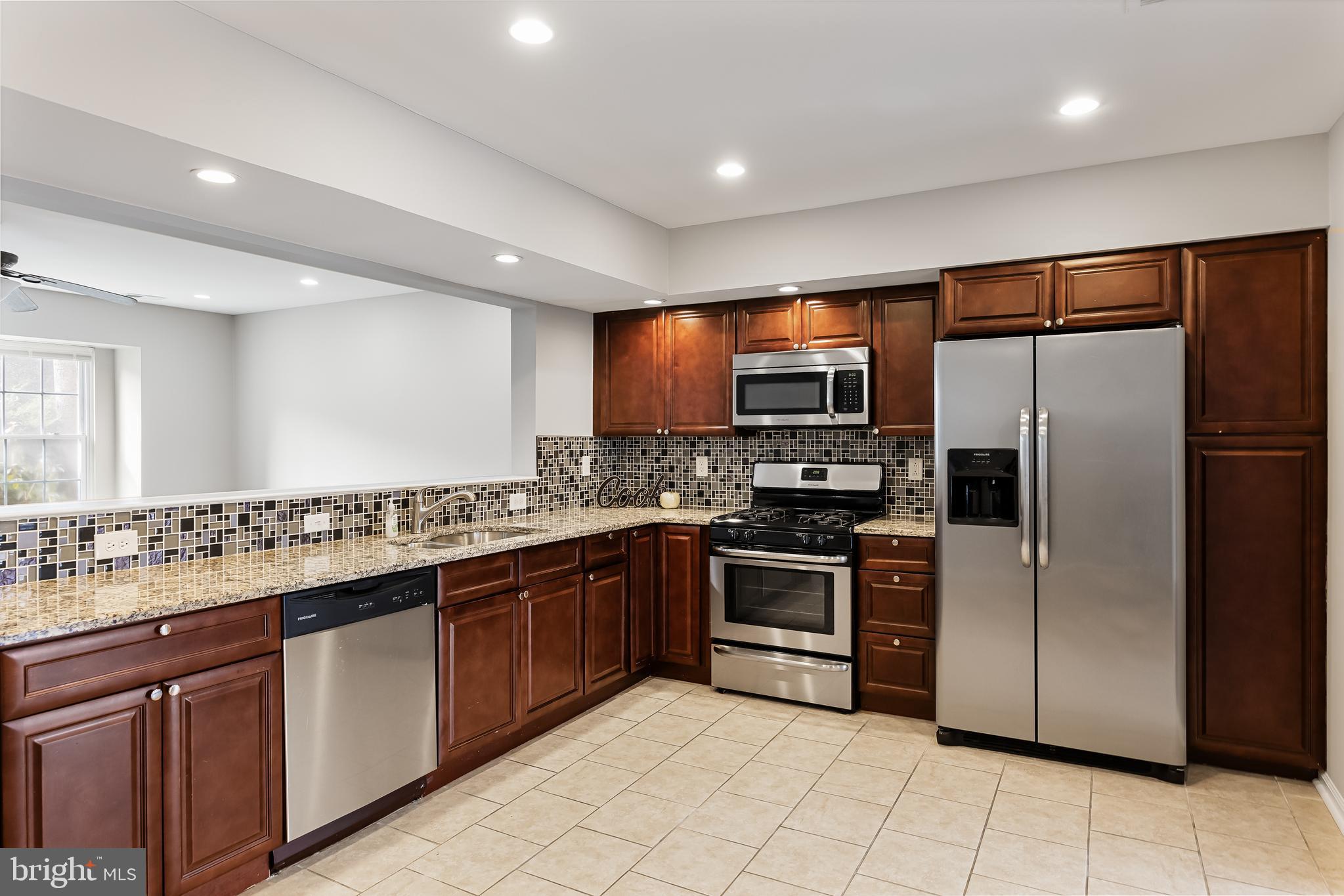 150 Baker Avenue Atco, NJ 08004 - Photo 10 of 32 a kitchen with stainless steel appliances granite countertop a refrigerator and a sink