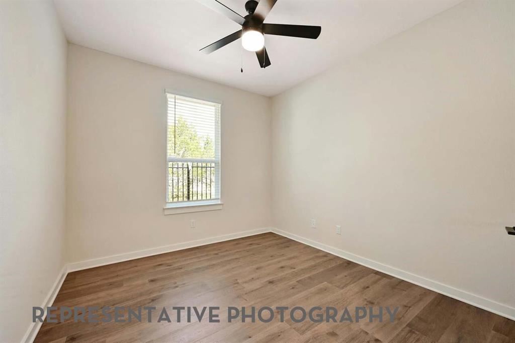 2620 Brooklyn Street Forney, TX 75126 - Photo 13 of 19 wooden floor in an empty room with a window