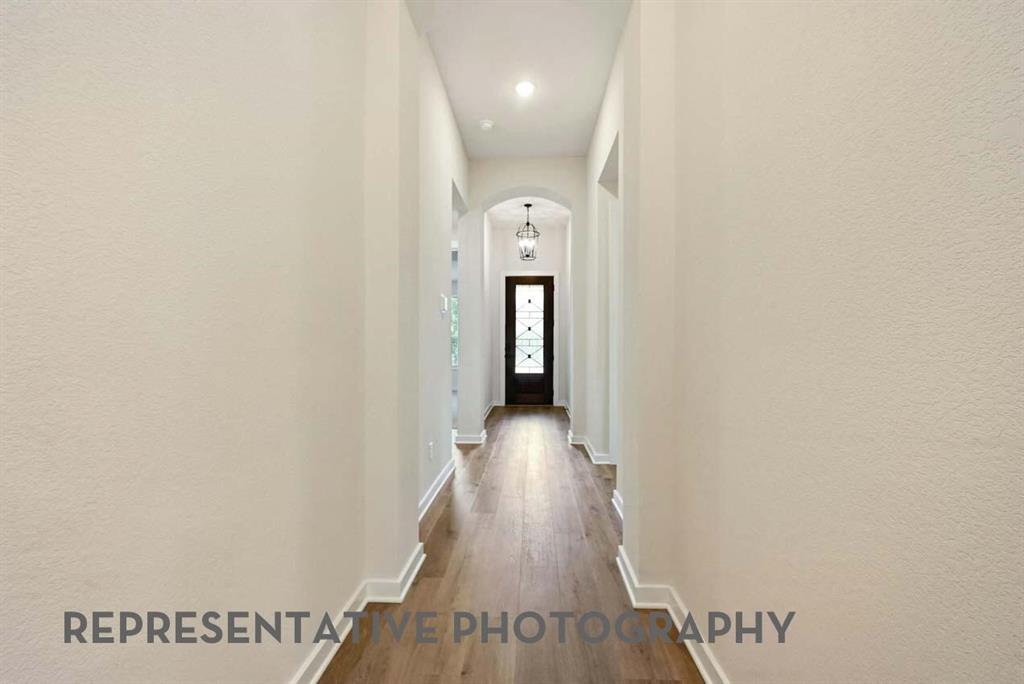 2620 Brooklyn Street Forney, TX 75126 - Photo 14 of 19 a view of a hallway with wooden floor