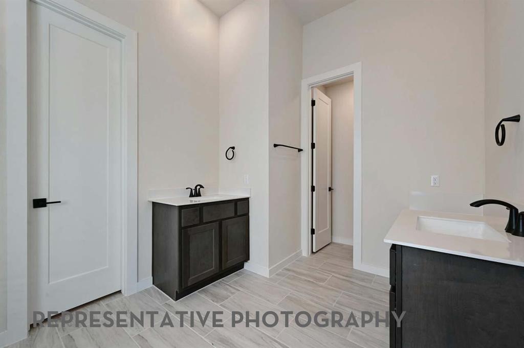 2620 Brooklyn Street Forney, TX 75126 - Photo 10 of 19 a bathroom with a sink and a mirror