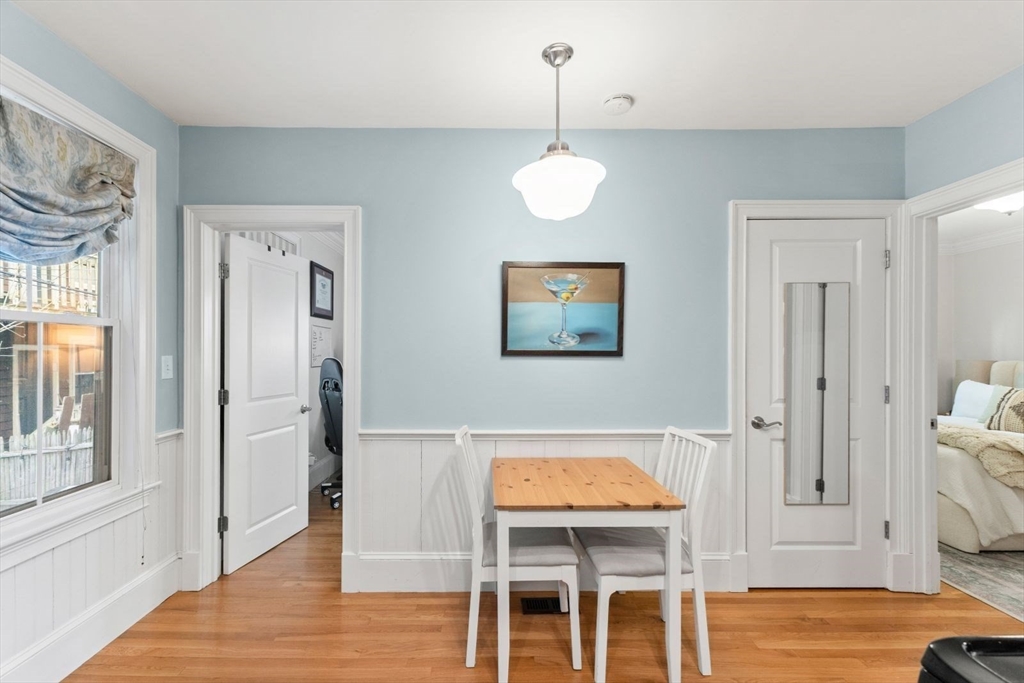 51-53 Story Street, Unit 1 Boston, MA 02127 - Photo 12 of 33 a view of a livingroom with furniture wooden floor chandelier and front door