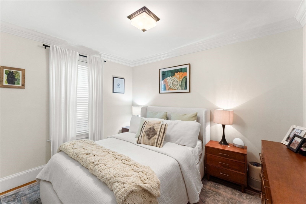 51-53 Story Street, Unit 1 Boston, MA 02127 - Photo 14 of 33 a bedroom with a bed and a painting