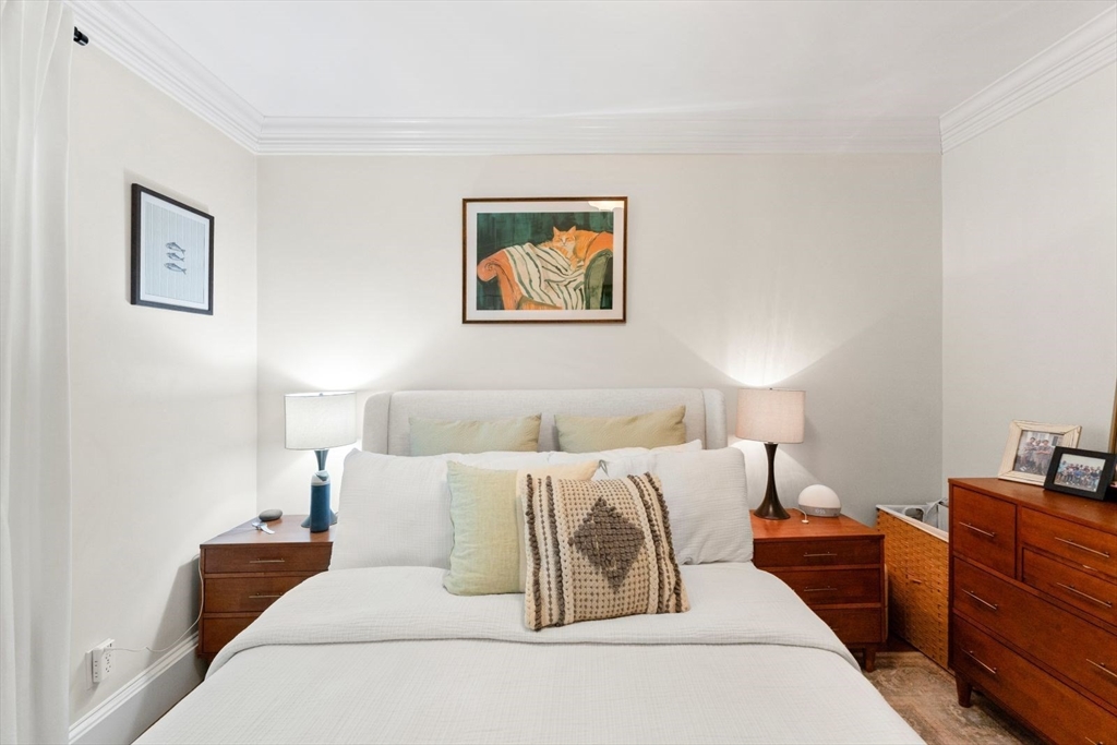 51-53 Story Street, Unit 1 Boston, MA 02127 - Photo 15 of 33 a bed room with a bed and a night stand