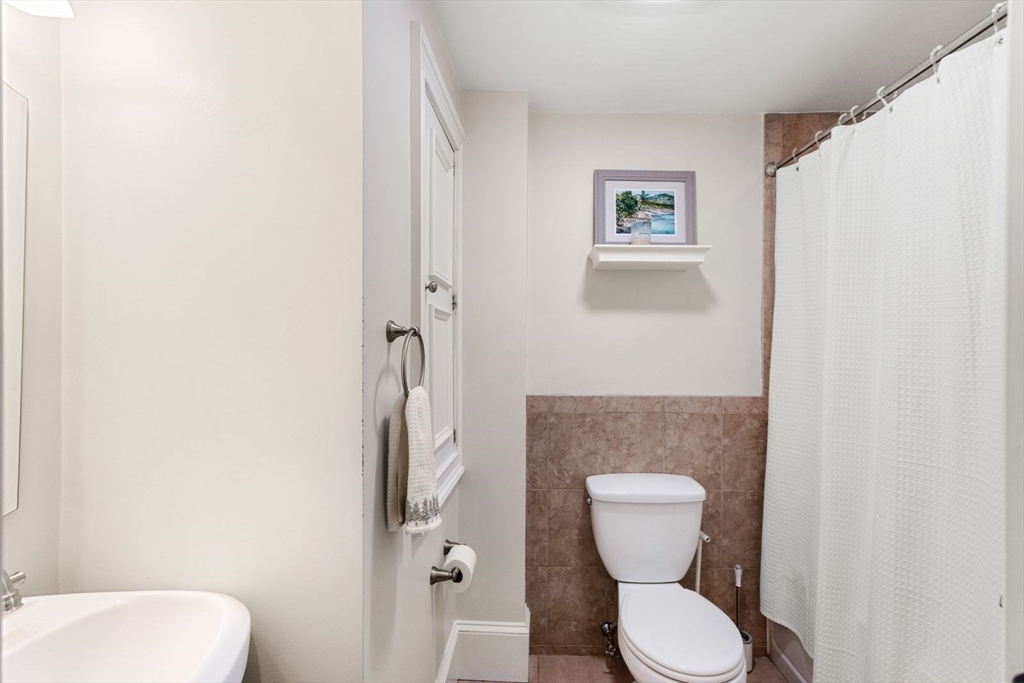 51-53 Story Street, Unit 1 Boston, MA 02127 - Photo 16 of 33 a bathroom with a toilet and a sink