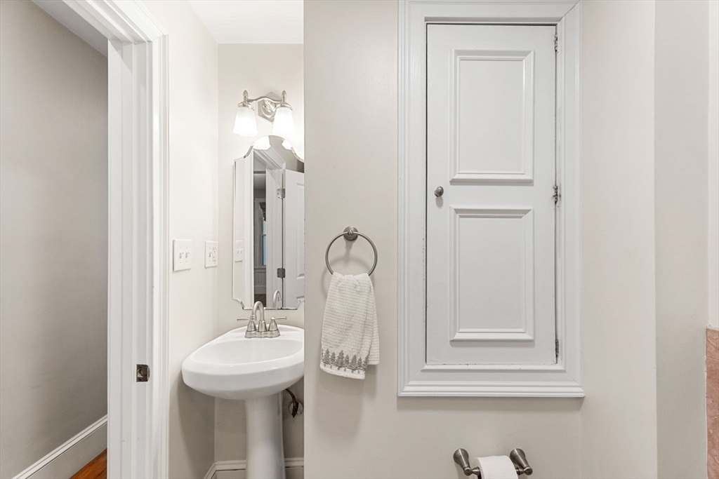 51-53 Story Street, Unit 1 Boston, MA 02127 - Photo 18 of 33 a bathroom with a sink and a mirror