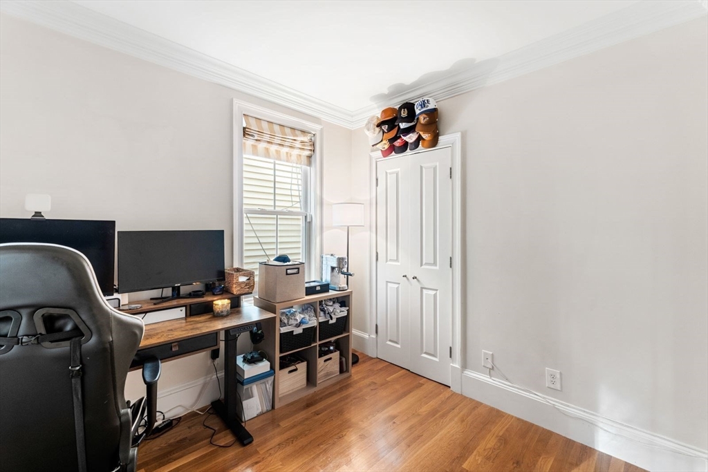 51-53 Story Street, Unit 1 Boston, MA 02127 - Photo 19 of 33 a view of a workspace with furniture and a window