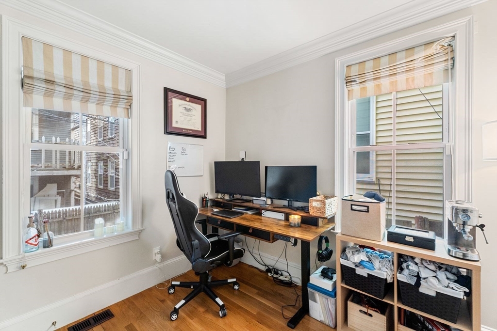 51-53 Story Street, Unit 1 Boston, MA 02127 - Photo 20 of 33 a view of a workspace with furniture and a window