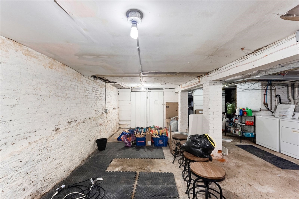 51-53 Story Street, Unit 1 Boston, MA 02127 - Photo 25 of 33 a room with furniture gym equipment and a chandelier