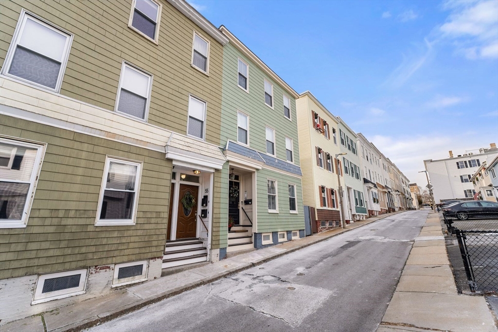 51-53 Story Street, Unit 1 Boston, MA 02127 - Photo 33 of 33 a city street lined with buildings and a street