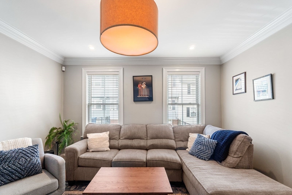 51-53 Story Street, Unit 1 Boston, MA 02127 - Photo 4 of 33 a living room with furniture flowerpot and window