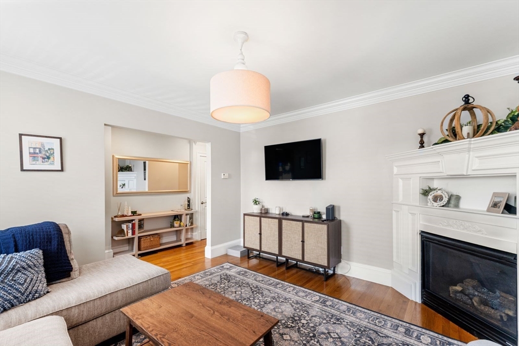 51-53 Story Street, Unit 1 Boston, MA 02127 - Photo 5 of 33 a living room with furniture and a flat screen tv