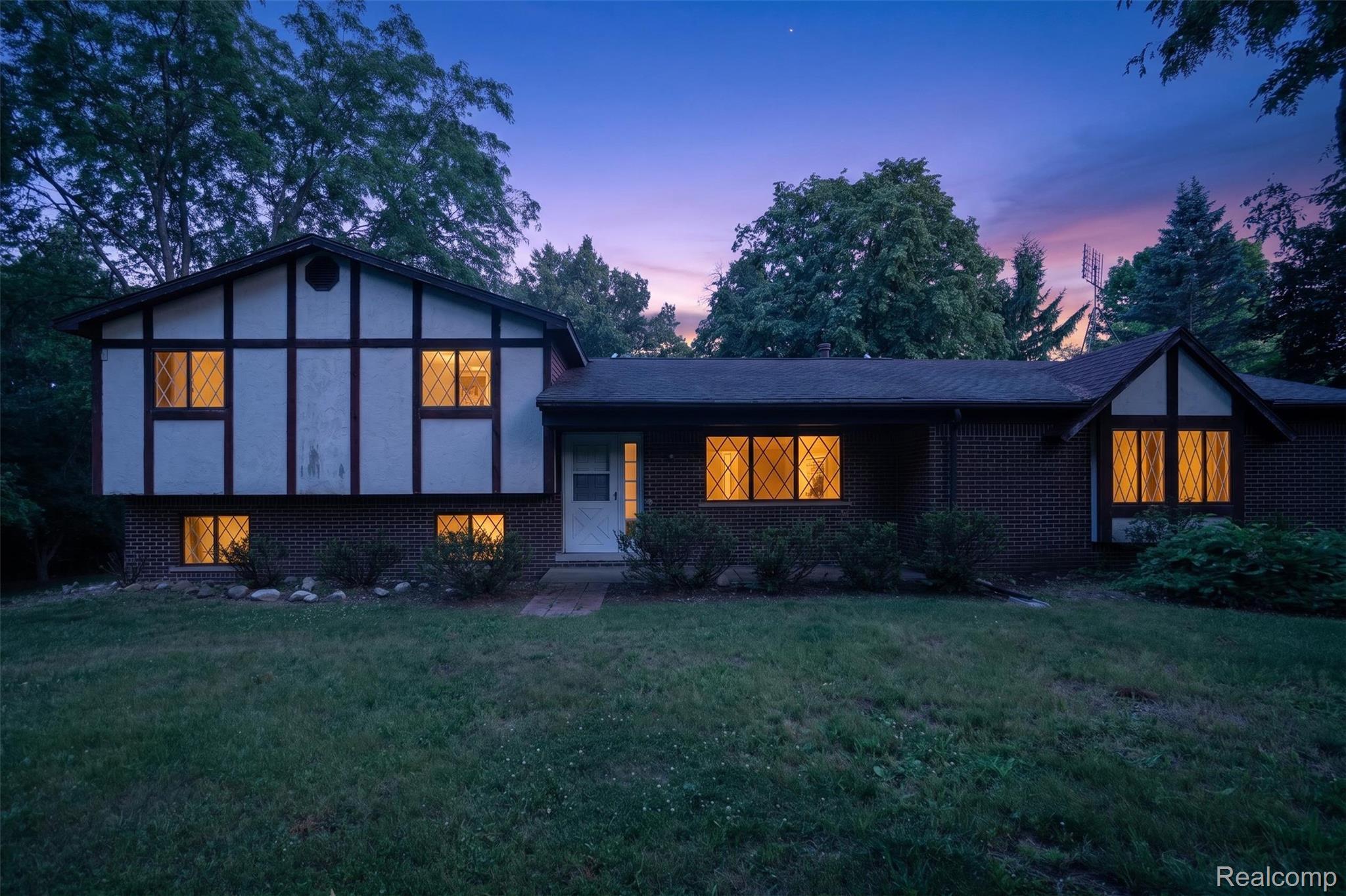 16955 English Road Manchester, MI 48158 - Photo 37 of 37 Split-level residence featuring a Tudor-style facade with dark timber accents and light-colored siding