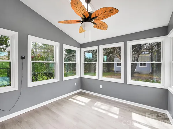 a view of an empty room with a window