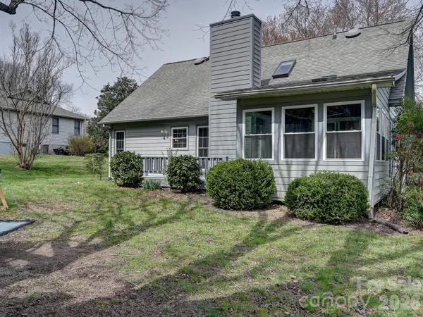 a view of a house with garden and plants