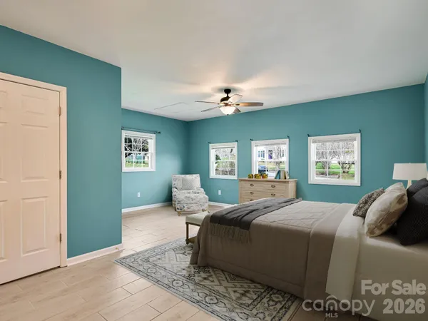 a bedroom with a bed and window