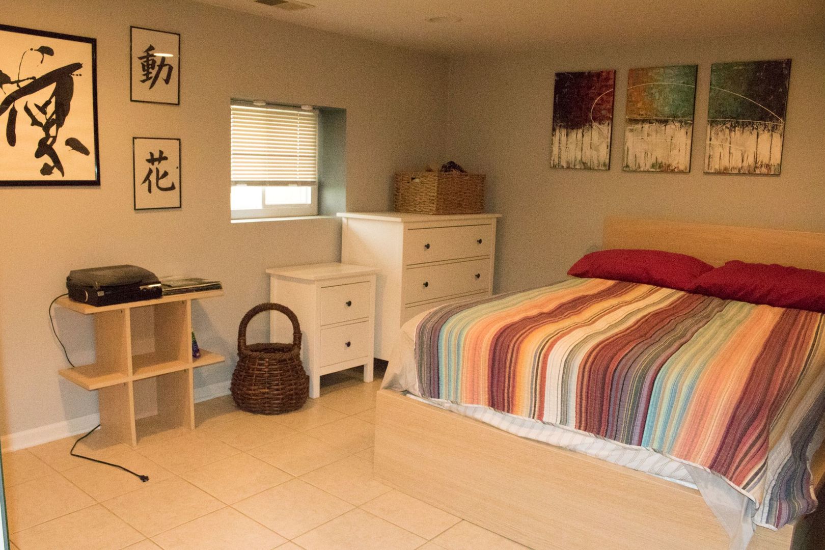 6310 West Warwick Avenue, Unit G Chicago, IL 60634 - Photo 6 of 10 a bedroom with a bed and wall painting