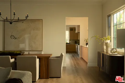 a view of a living room with furniture and a window