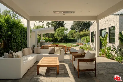 a living room with a window and a table