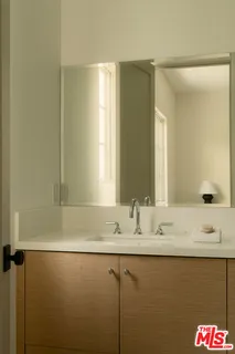 a bedroom with bed and window