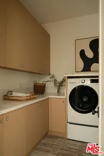 an aerial view of a residential houses with yard