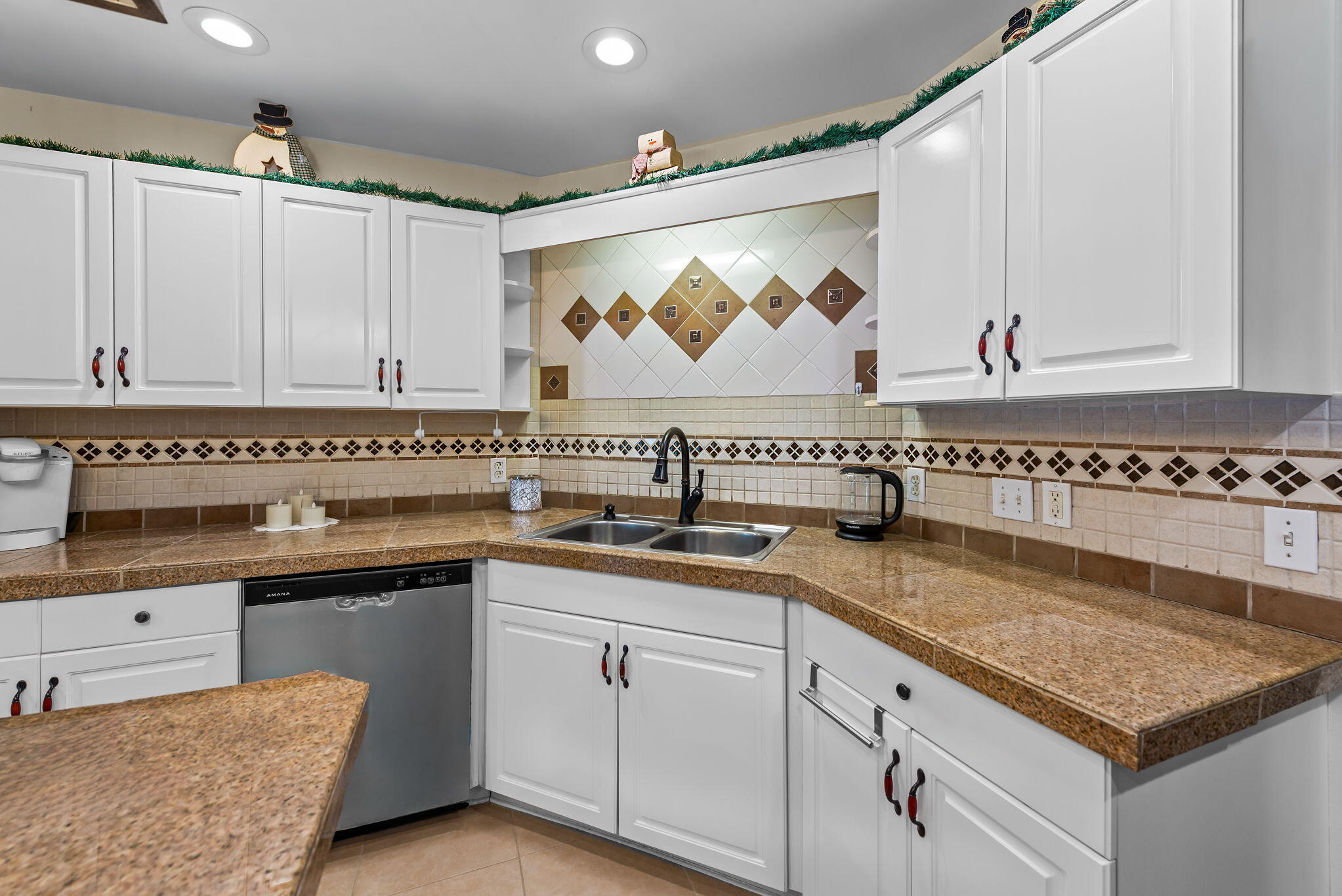 7373 Rexford Street Navarre, FL 32566 - Photo 11 of 56 a kitchen with granite countertop a sink and a stove
