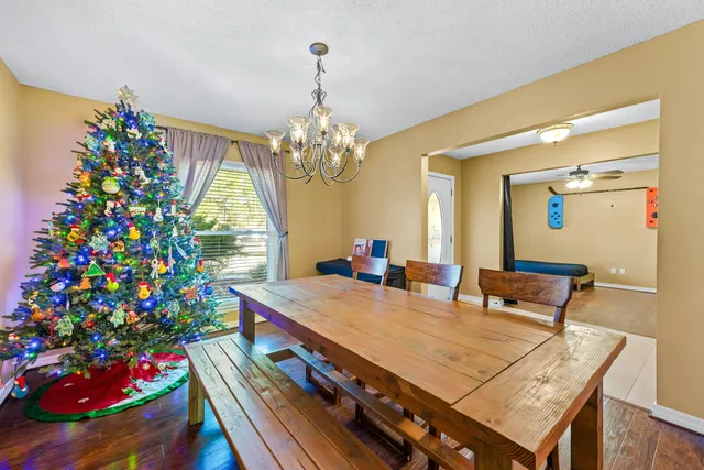 a bed room with a bed and a chandelier