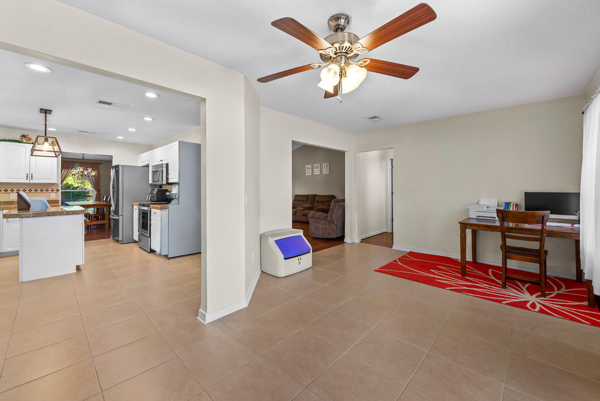 7373 Rexford Street Navarre, FL 32566 - Photo 17 of 56 a living room with furniture and kitchen view