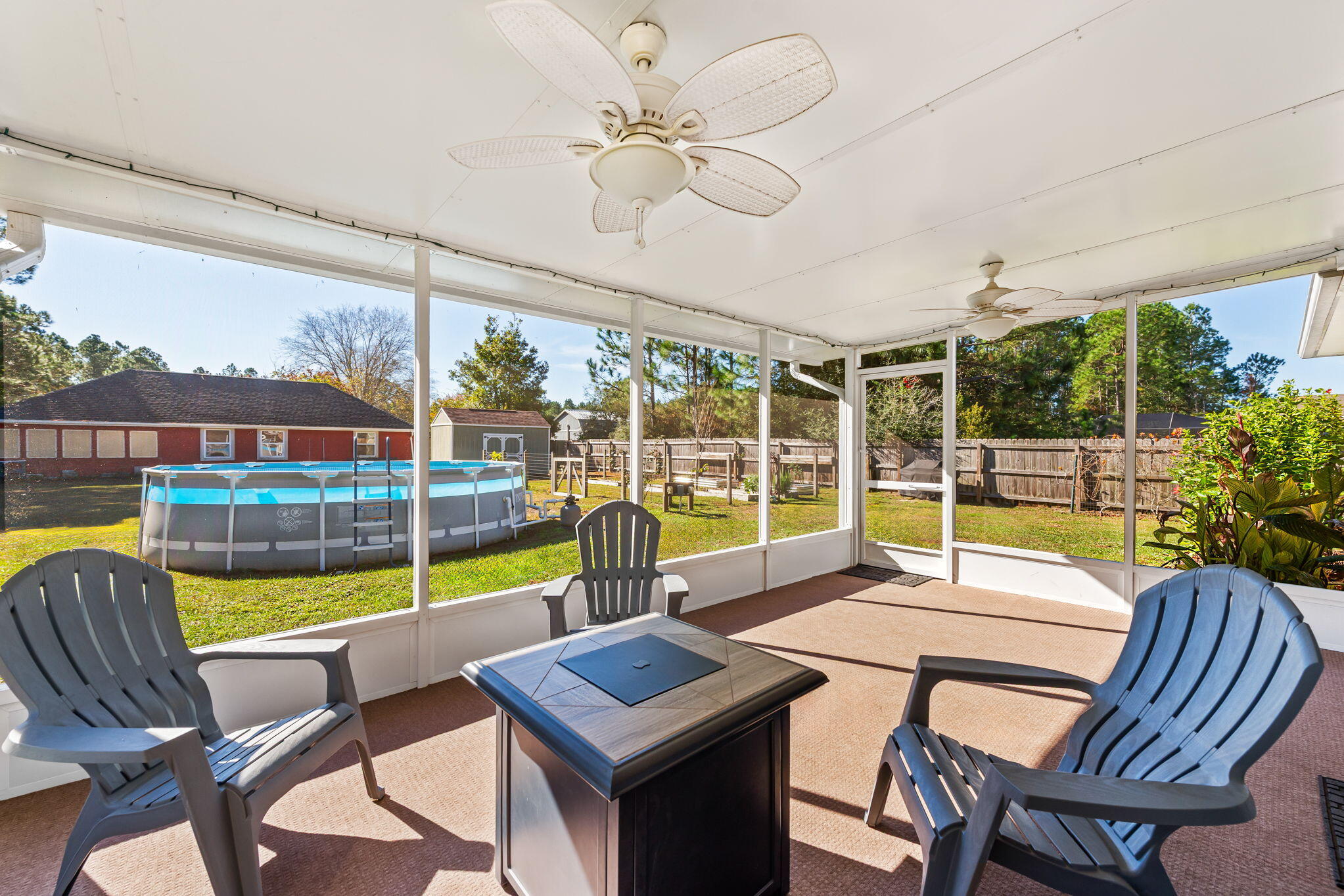 7373 Rexford Street Navarre, FL 32566 - Photo 2 of 56 a view of a dining room with furniture window and outside view