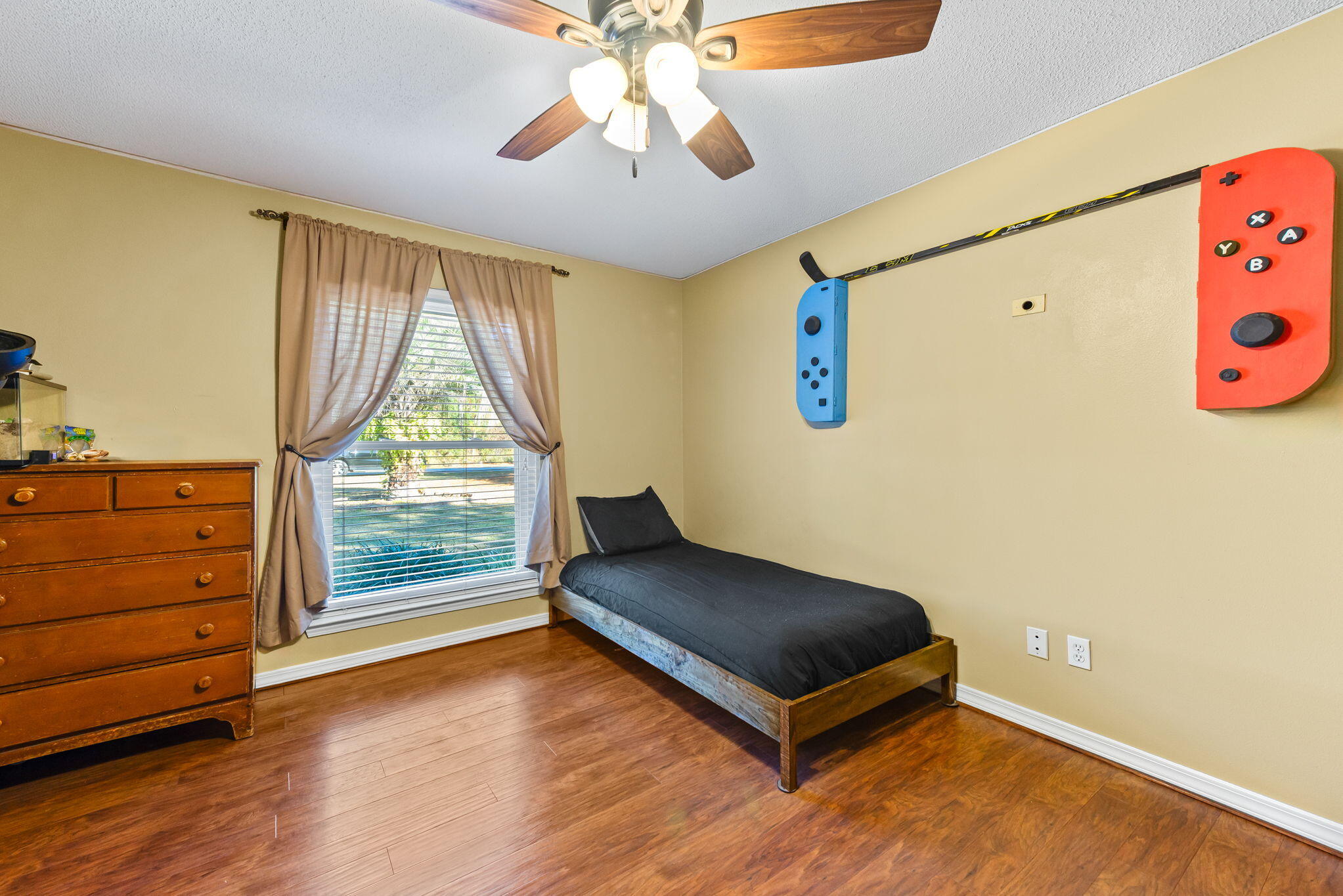 7373 Rexford Street Navarre, FL 32566 - Photo 21 of 56 a living room with a bed and a window