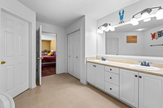 a bedroom with double bed and a lamp