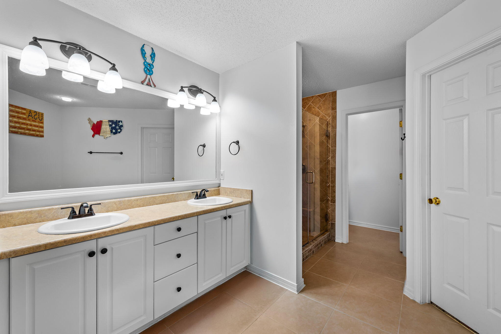 7373 Rexford Street Navarre, FL 32566 - Photo 29 of 56 a spacious bathroom with a double vanity sink mirror and double