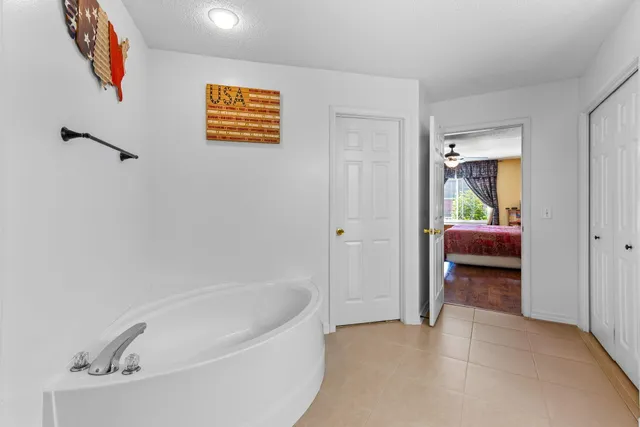 a bed room with a bed and a window