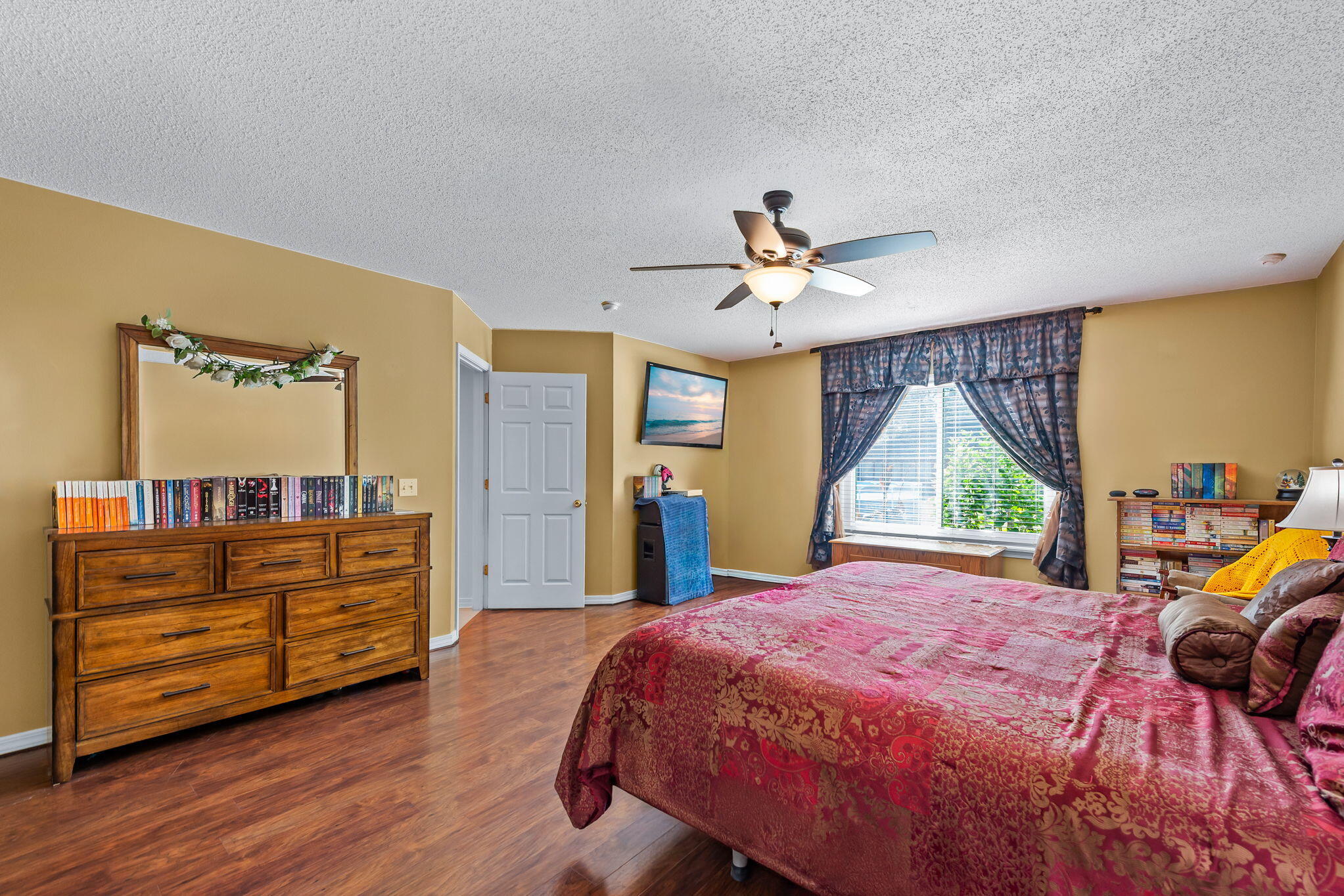 7373 Rexford Street Navarre, FL 32566 - Photo 31 of 56 a bedroom with a bed and a large dresser