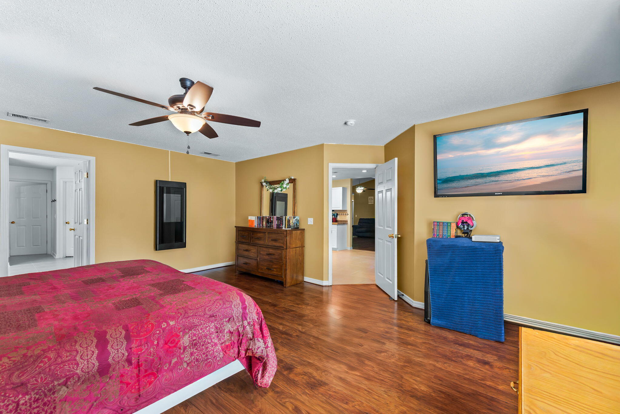 7373 Rexford Street Navarre, FL 32566 - Photo 32 of 56 a bed room with a bed and a chandelier