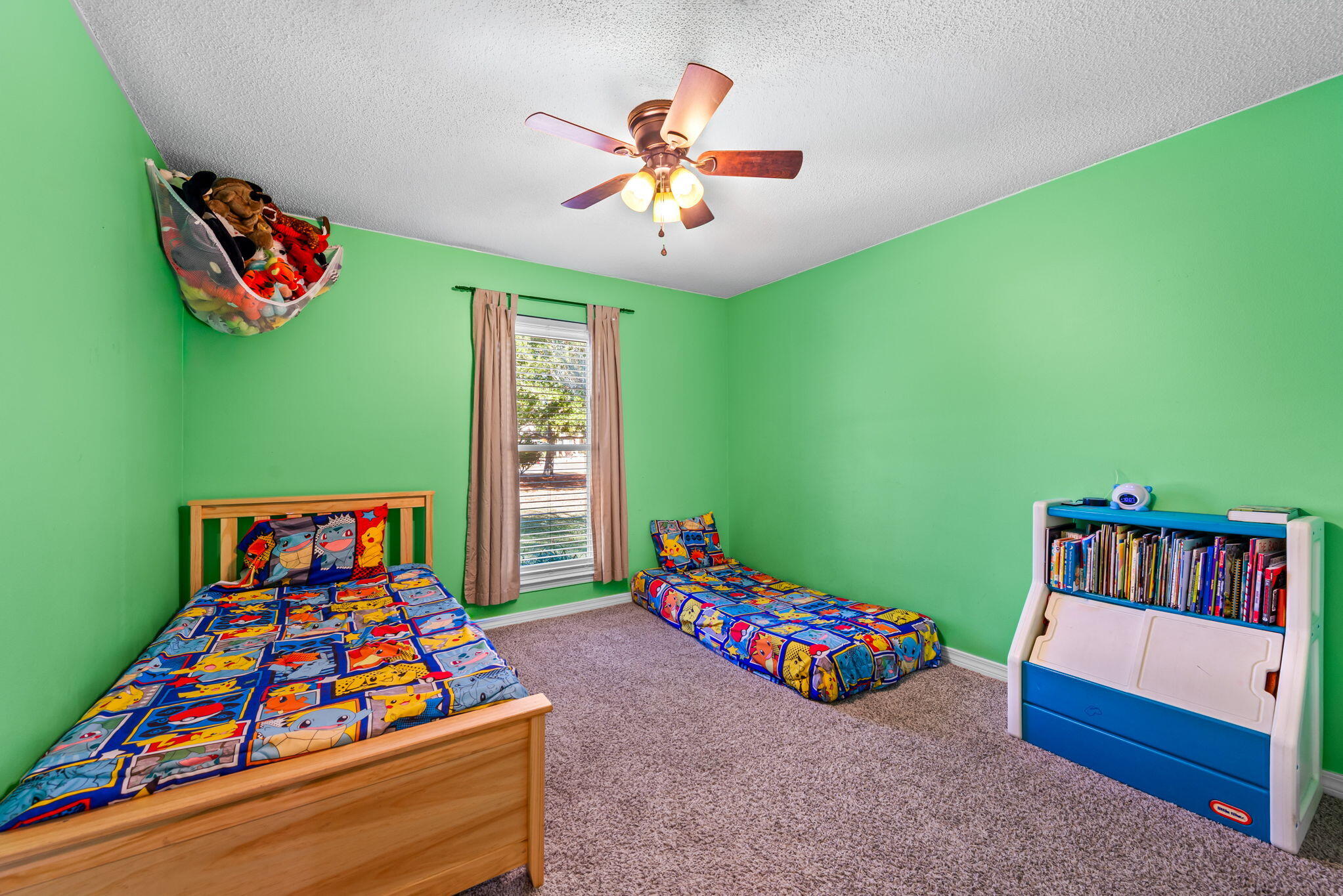 7373 Rexford Street Navarre, FL 32566 - Photo 38 of 56 a bedroom with a bed and a large window