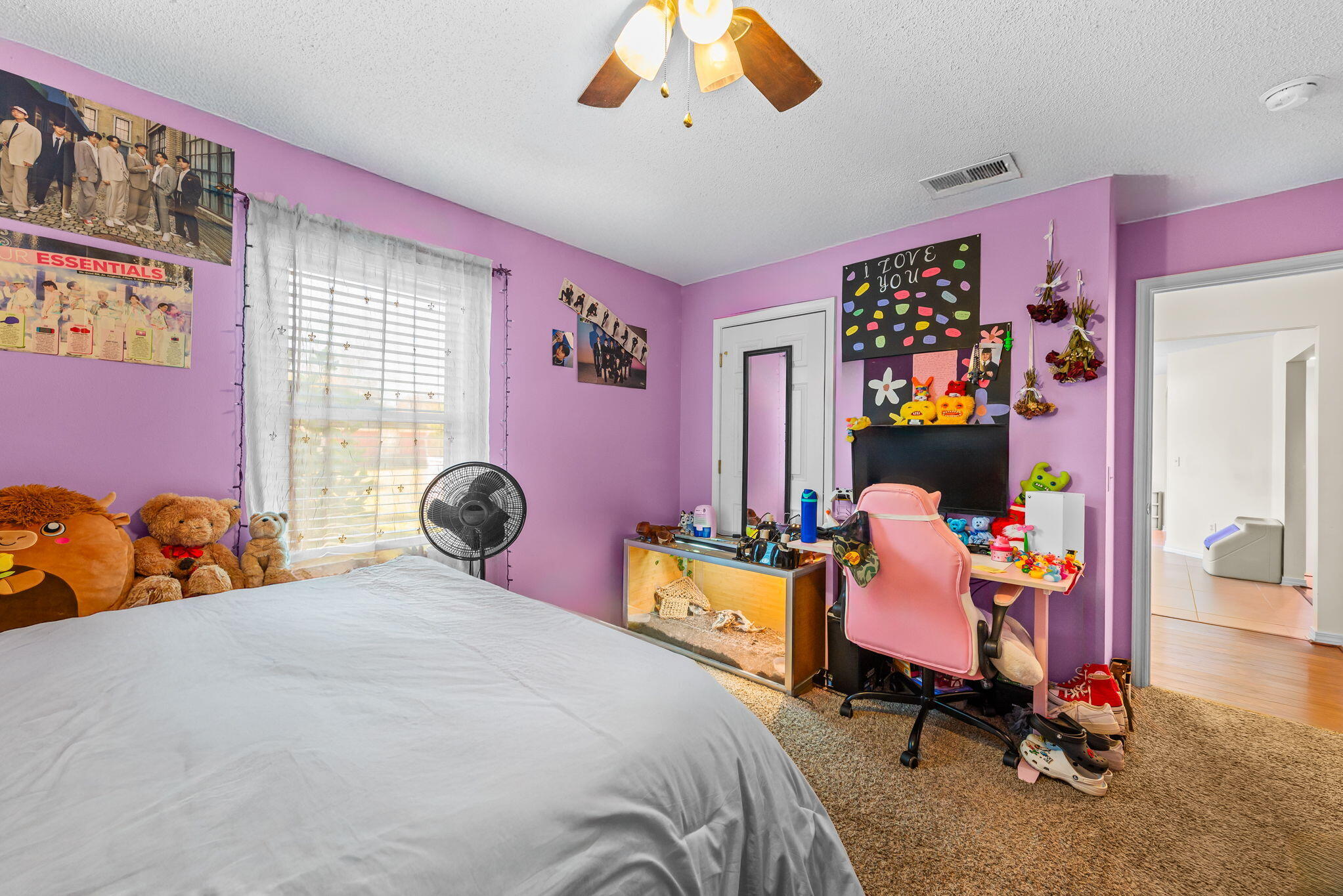 7373 Rexford Street Navarre, FL 32566 - Photo 41 of 56 a bedroom with a bed and a chandelier