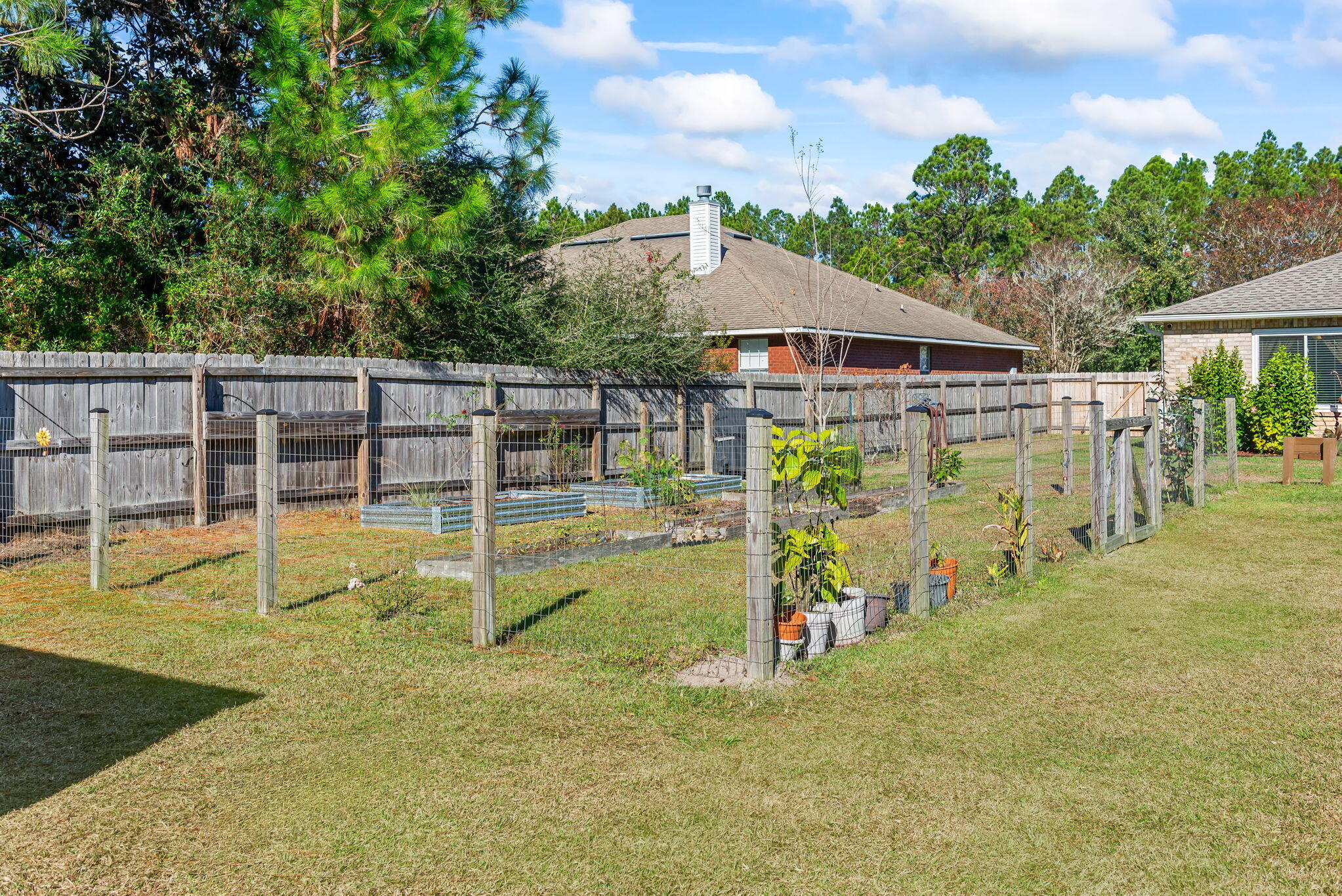 7373 Rexford Street Navarre, FL 32566 - Photo 43 of 56 a view of a house with swimming pool