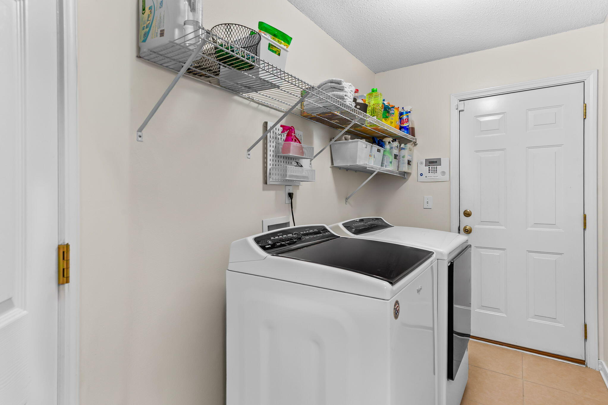 7373 Rexford Street Navarre, FL 32566 - Photo 46 of 56 a kitchen with a stove a sink and dishwasher