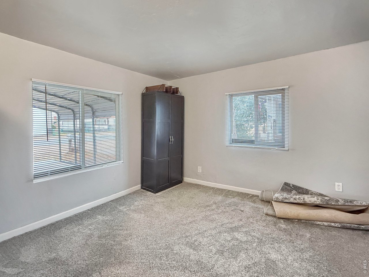 720 Phelps Street Sterling, CO 80751 - Photo 14 of 27 a view of an empty room with a window