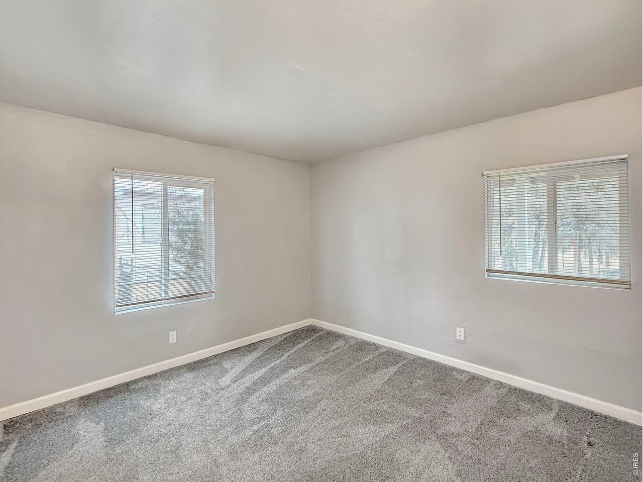 720 Phelps Street Sterling, CO 80751 - Photo 18 of 27 an empty room with a window