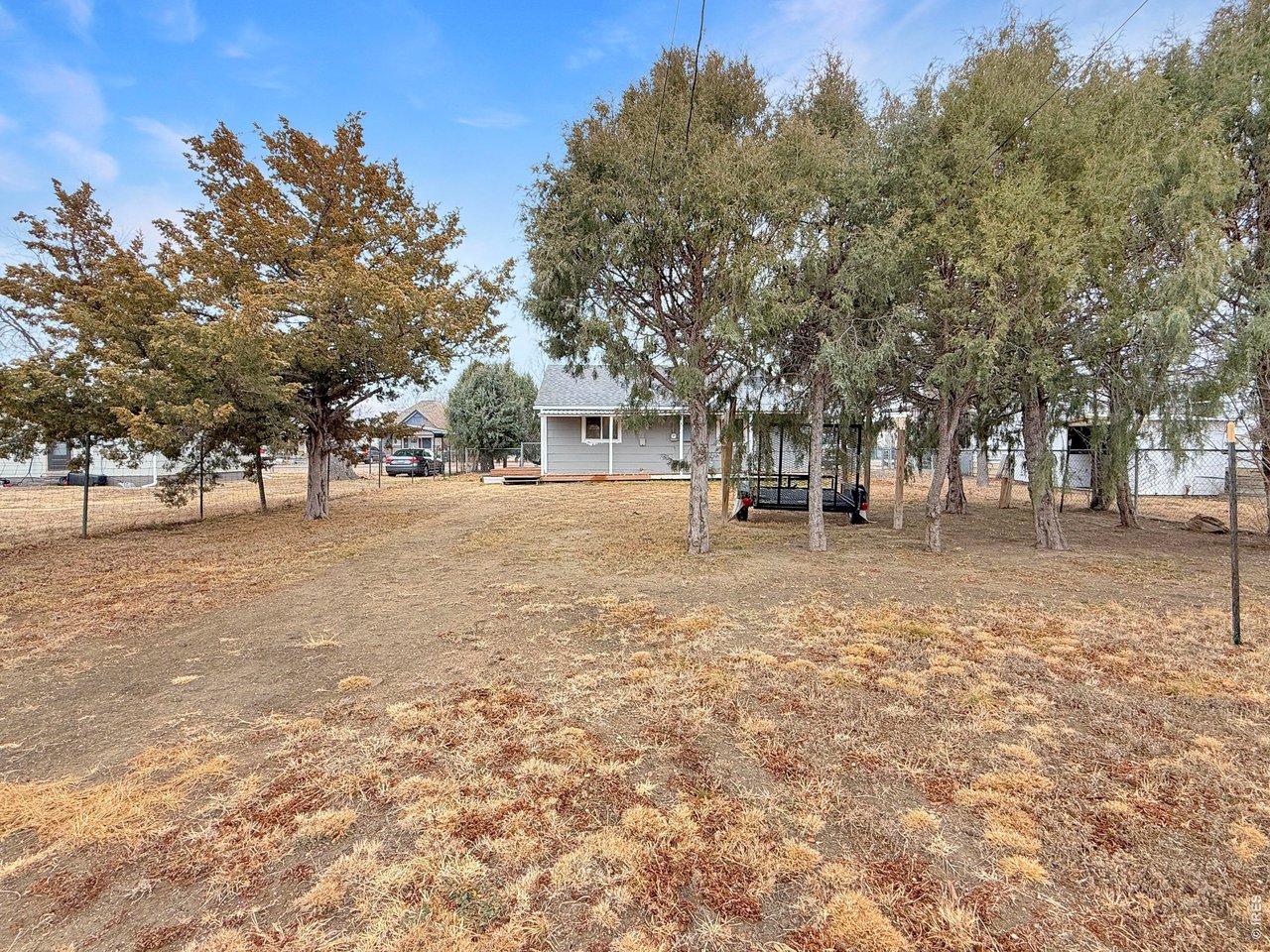 720 Phelps Street Sterling, CO 80751 - Photo 23 of 27 a view of road with trees