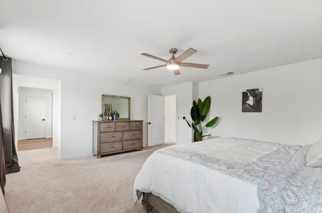 a spacious bathroom with a double vanity sink a mirror and shower